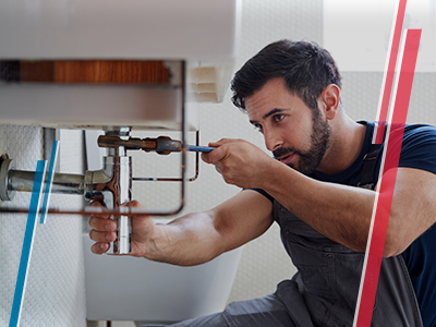 Servicio de Plomería Hombre arreglando baño